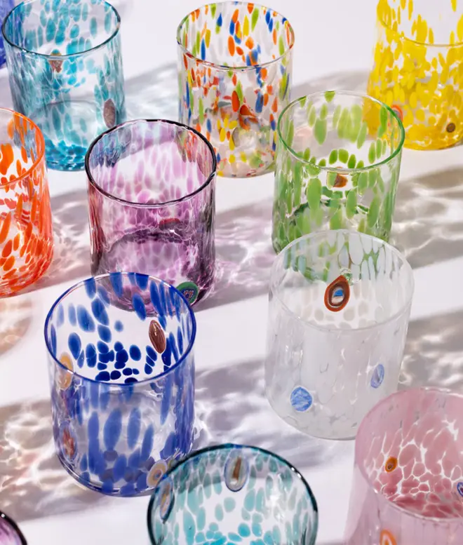 selection of ten glass tumblers, in different vibrant colour patterns