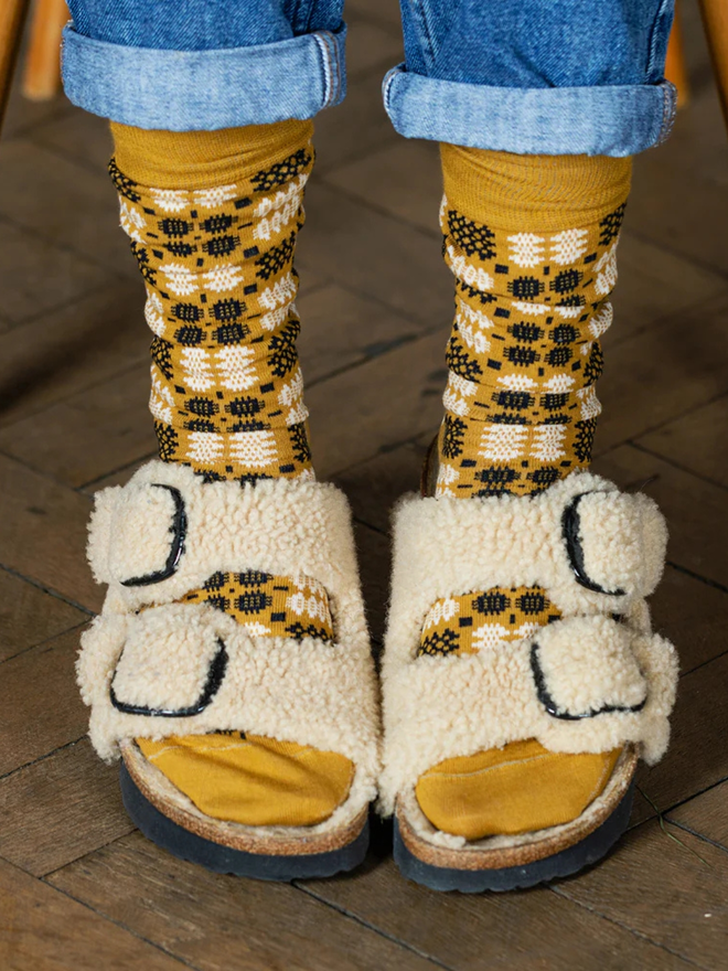 yellow brown knitted socks with sandals