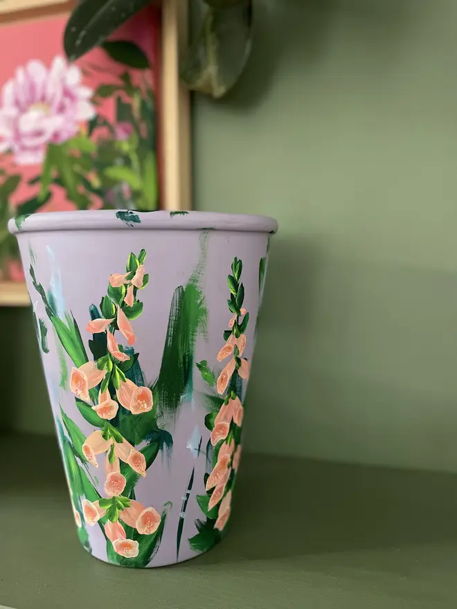 hand painted floral terracotta interior plant pot lilic background apricot foxglove flowers
