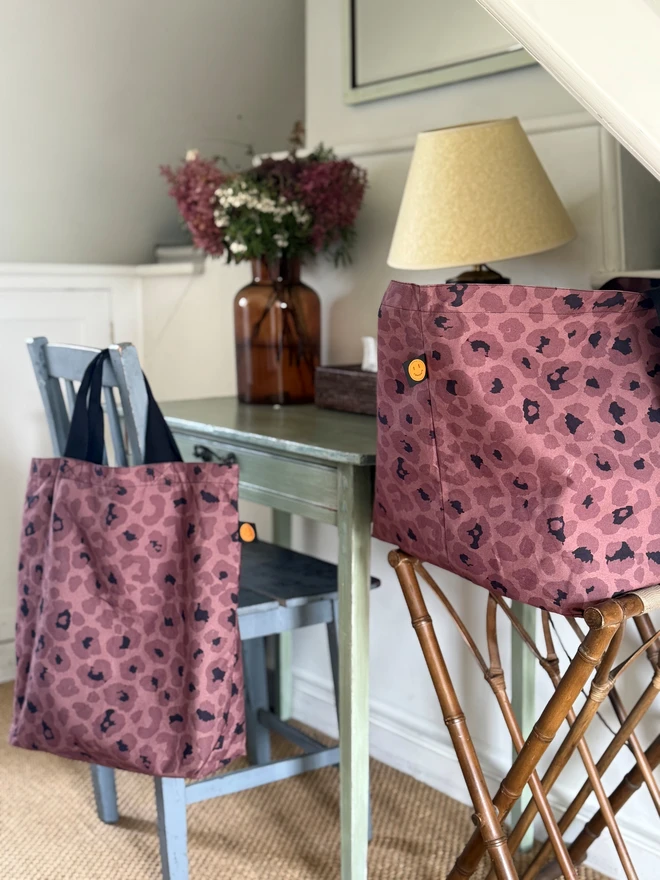 mocha leopard large bag on table and bookbag on chair