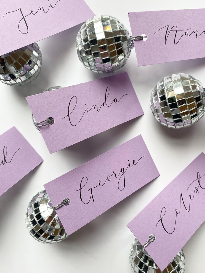 handwritten calligraphy disco ball wedding place card settings