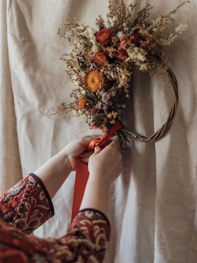 Dried Flowers with Hands on a white background