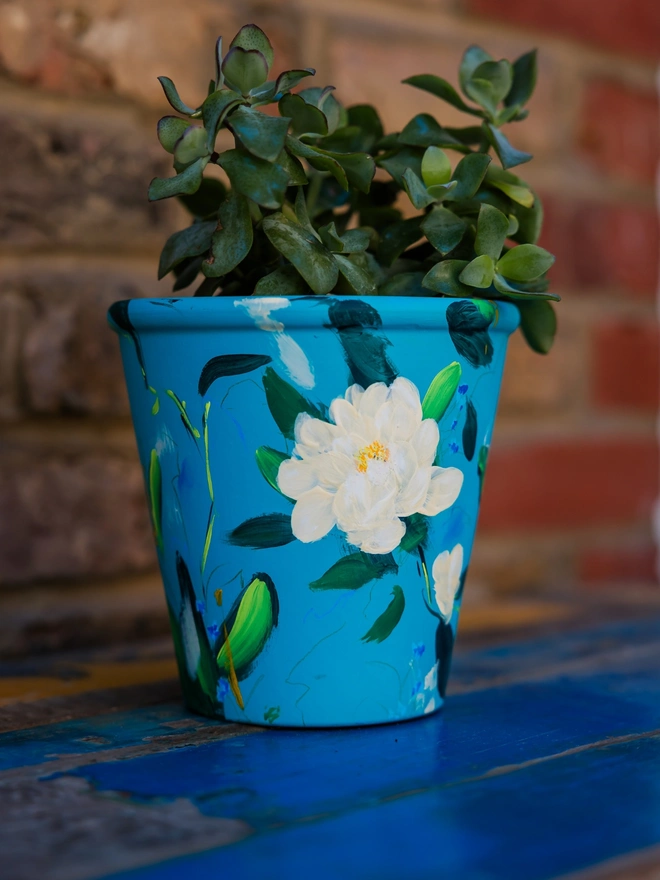 Hand painted floral plant pot, turquoise background with pale yellow peonies 