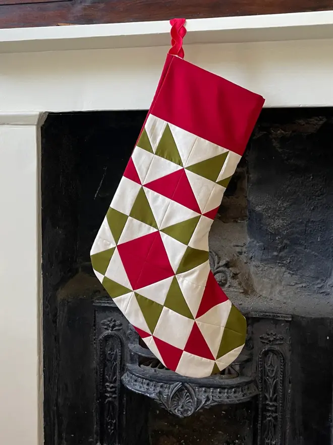 Spruce Patchwork Stocking, hanging. 