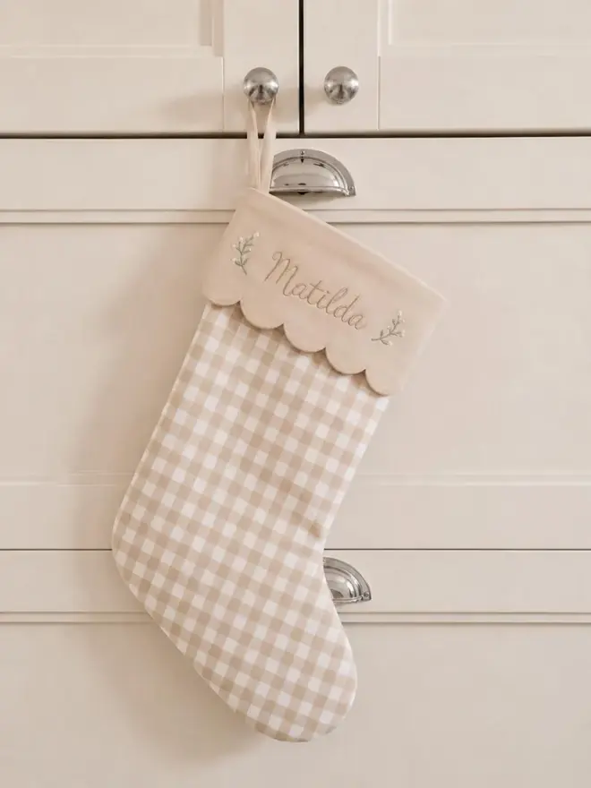 beige stocking with scalloped top and personalised embroidery