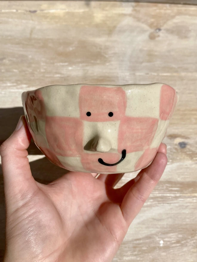 rose checkerboard ceramic pot - held