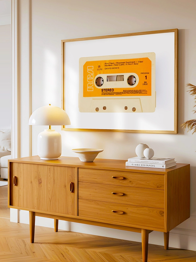 david bowie rise and fall of ziggy stardust cassette print. print framed and hung above wooden dresser.