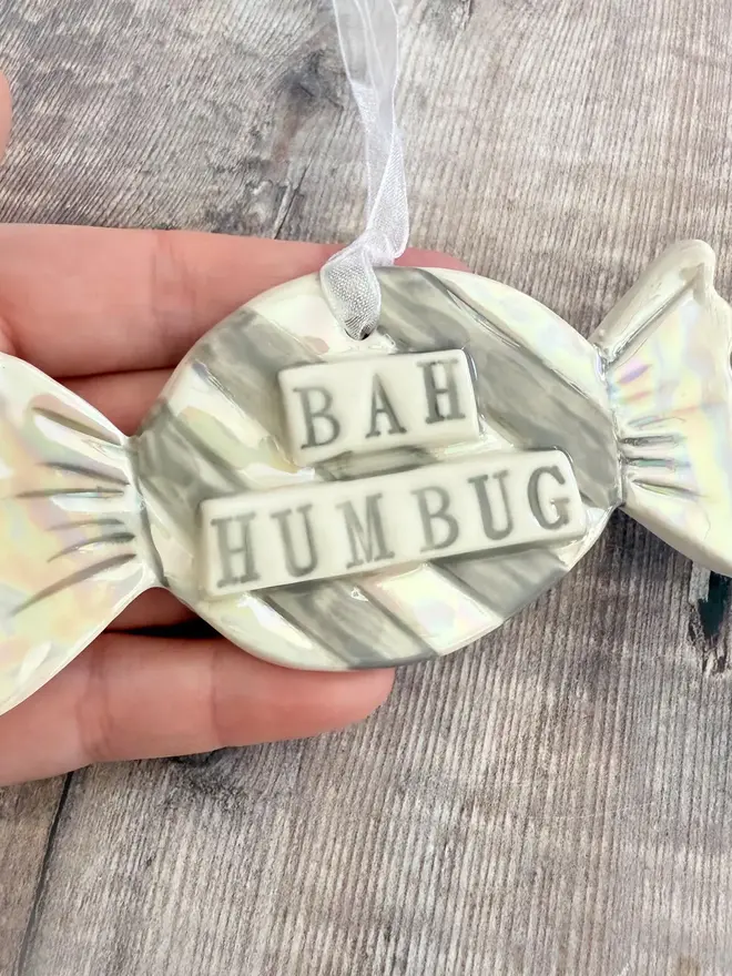 'Bah Humbug' Handmade Porcelain Sweet Christmas Decoration, decoration above a table. 