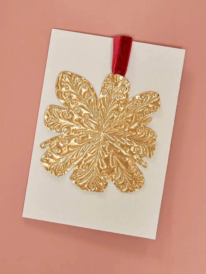 Snowflake embossed tin decoration