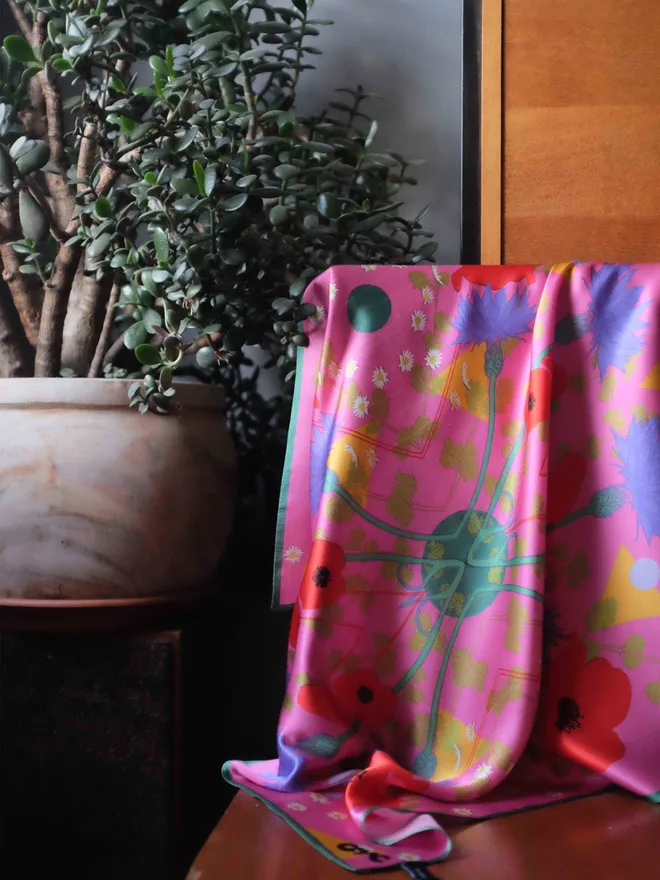 'In Bloom' Silk Scarf draped over the back of a chair