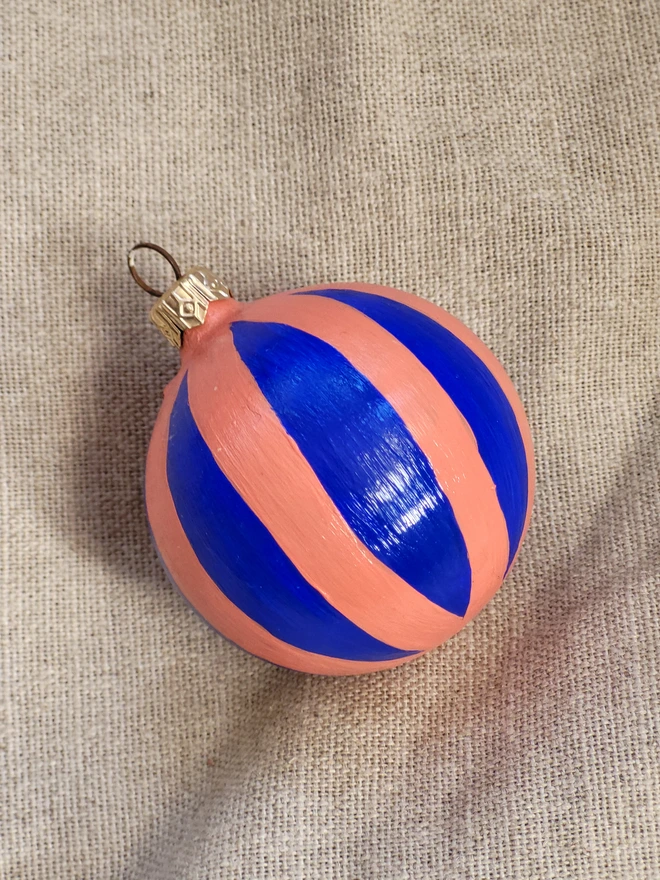 Cobalt blue bauble with coral stripes