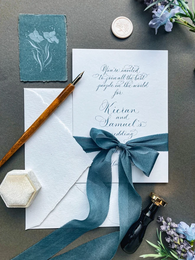 bespoke calligraphy wedding invitations. white paper invitations with black calligraphy.