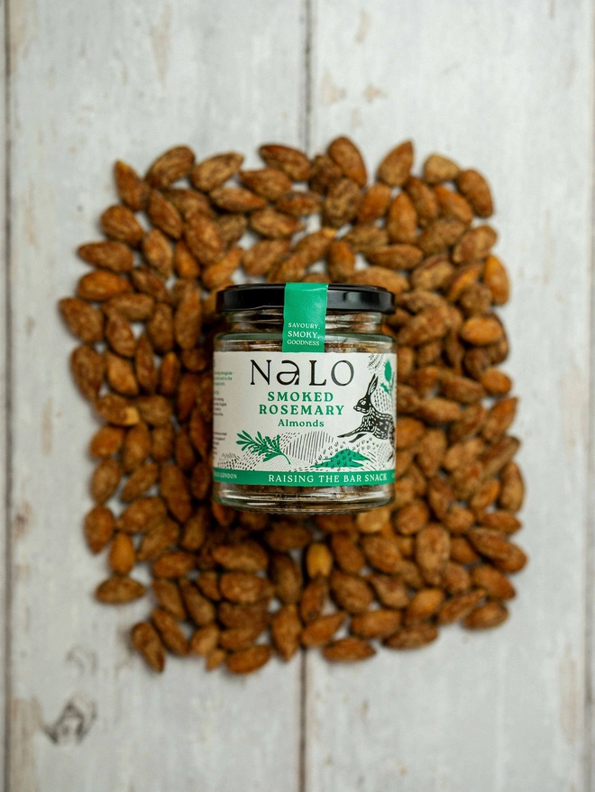 Smoked Rosemary Almonds, displayed on a wooden stable. 