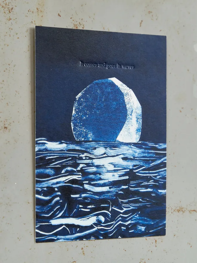 'It comes and goes in waves' artwork - a deep midnight blue with the moon and embossed text, against a grey locker background
