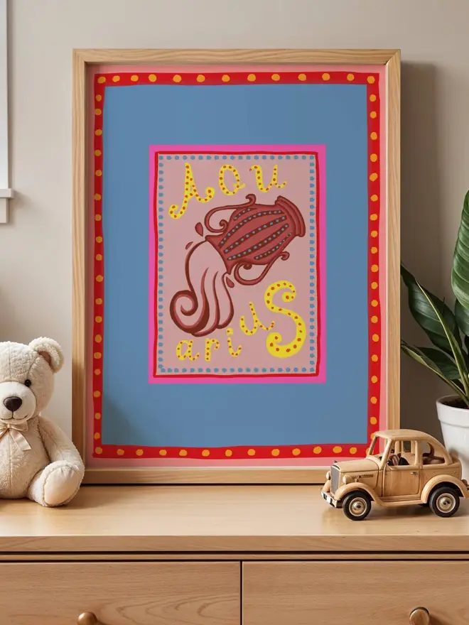 Aquarius illustration print in a frame with colourful boarder 