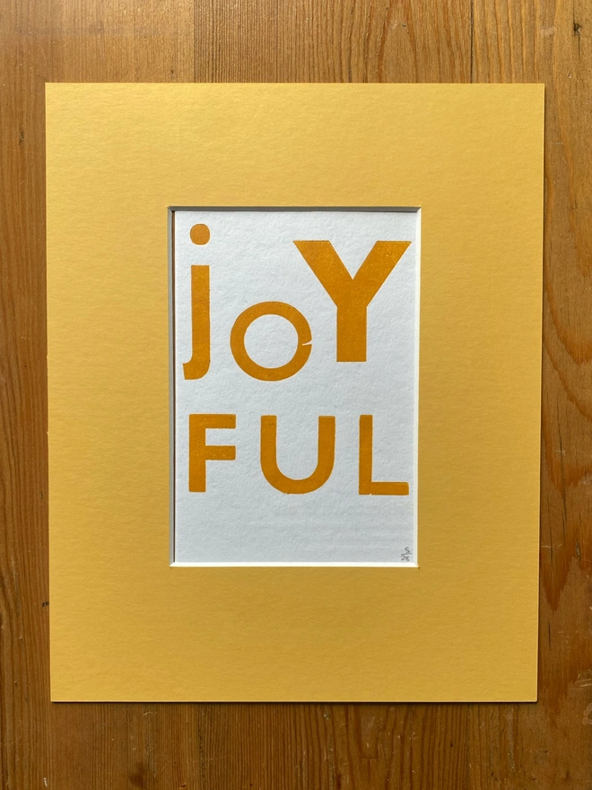 Joyful poster letterpress printed from vintage wood type in yellow mount