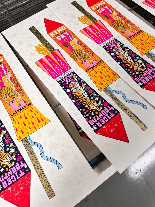 Rocket Fireworks Screenprint Howling Balls Of Fire, a pair of colourful firework designs on a white piece of paper. 