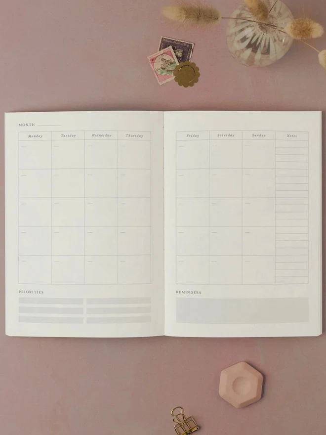 Pinstripe Weekly Planner open to a monthly overview spread