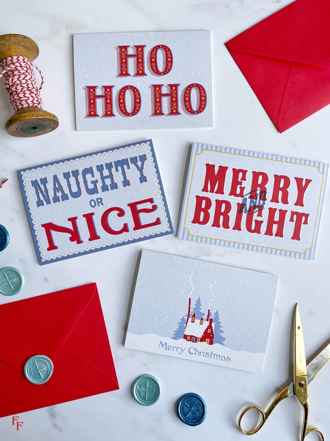 flat lay of christmas cards red and blue