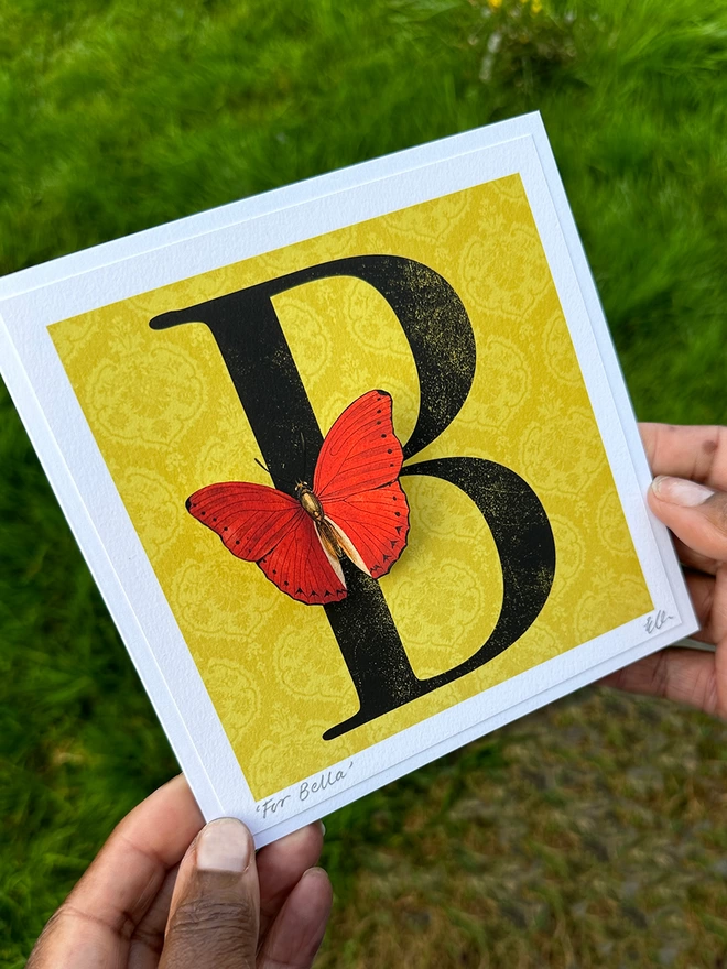 Recipient holding their personalised birthday butterflygram  