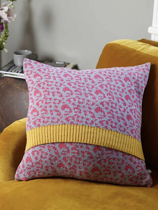 Lambswool Patterned Cushion, a cushion sitting on a yellow chair in a living room. 