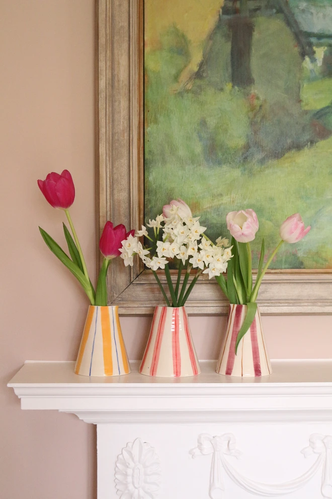 Three handmade and hand painted ceramic vases with stripes