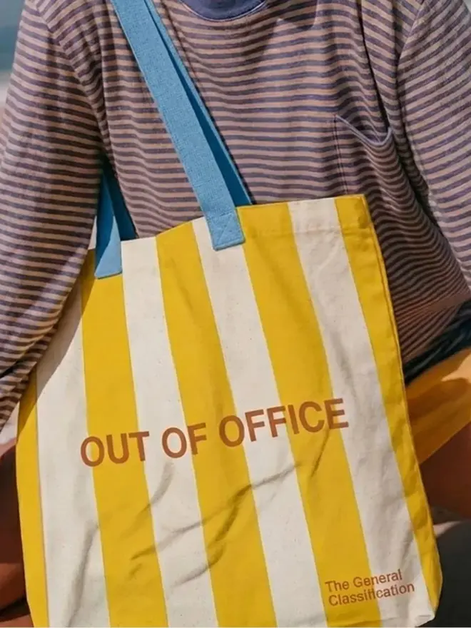 Out Of Office Tote Bag, worn by a woman. 