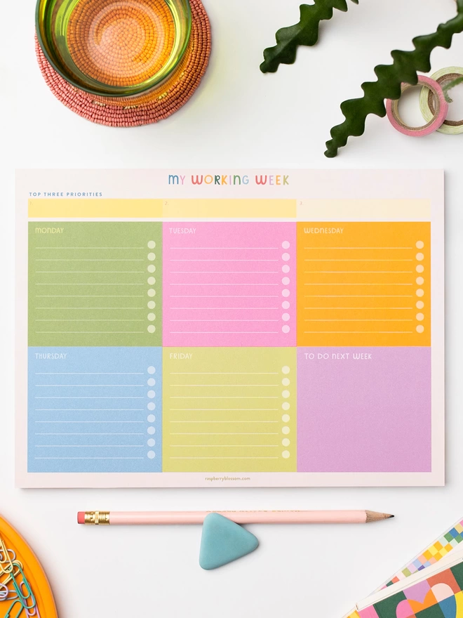 Raspberry Blossom ‘My working week’ weekly planner pad is split into brightly coloured sections for each day of the working week with tick boxes for each task and even a section for jobs to carry over into the next week