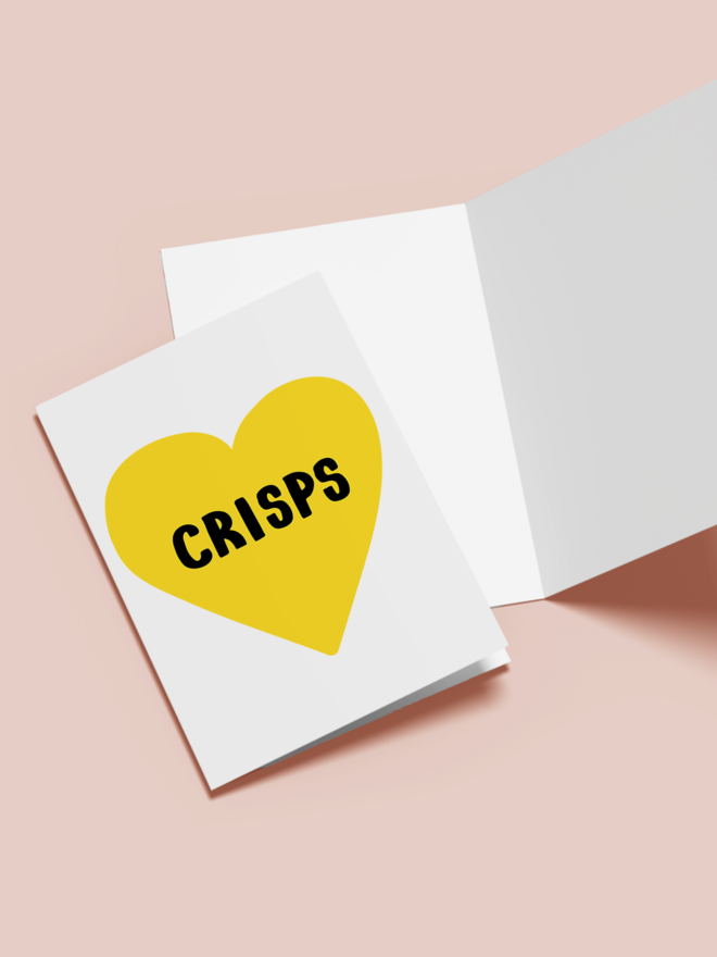 'crisps lover' card. a white card with a yellow heart with 'crisps' written in the middle.