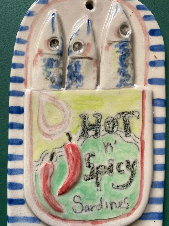 spicy sardine ceramic wall hanging
