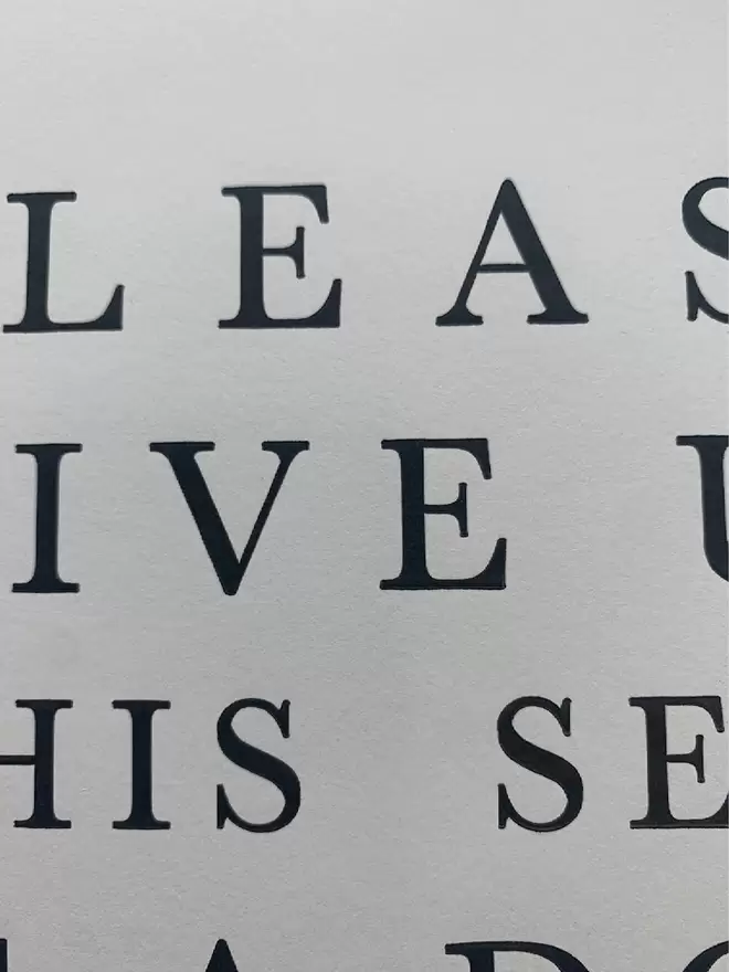 Close up of a black and white print with a serif font.
