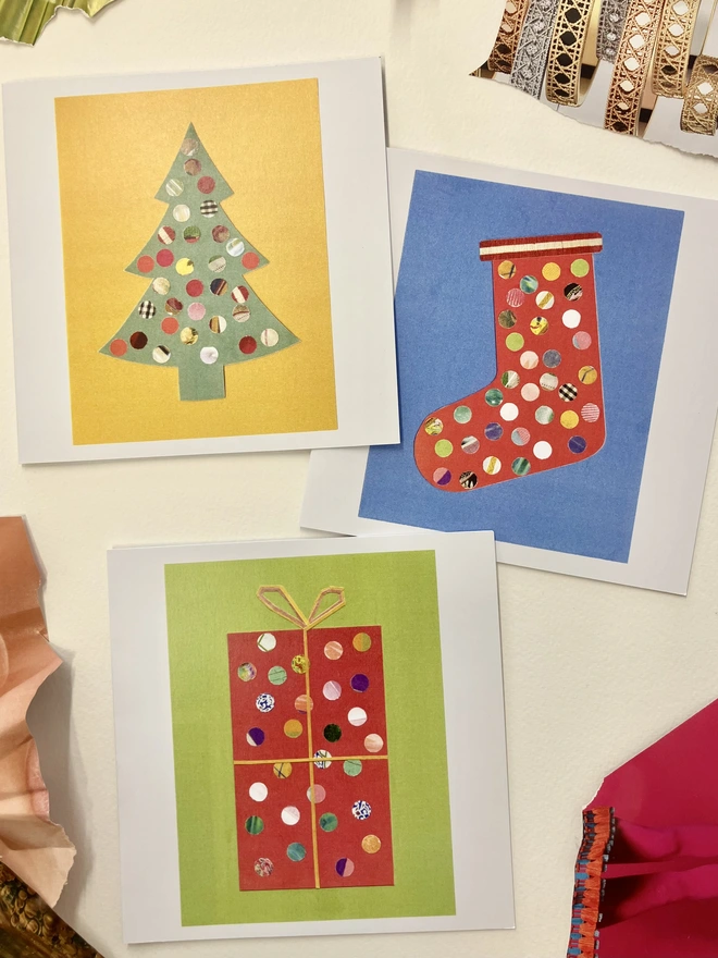 set of 3 Christmas cards featuring sprinkle illustrations of a tree, stocking and gift on a white background with collage papers 