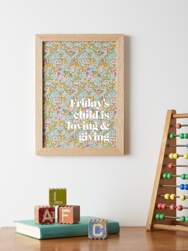 Friday's child is loving & forgiving picture on Liberty fabric with white typography