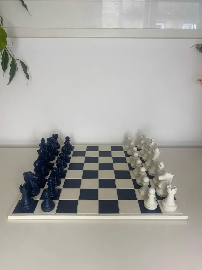 Handmade Jesmonite Chess Board, a handmade colourful chess board sitting on a white surface. 
