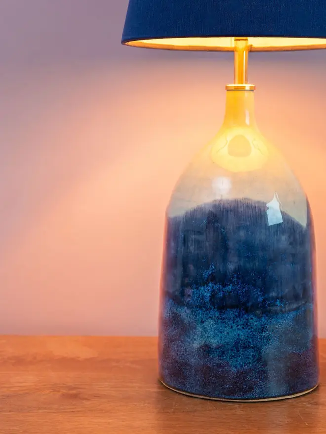 Bottle lamp with shades of blues and pinks