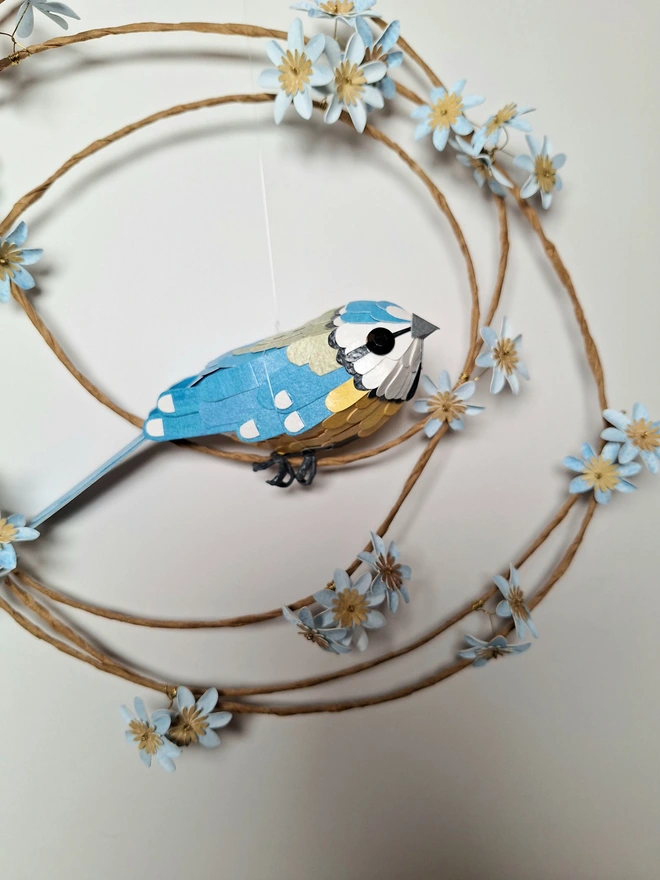 Close up of a handmade paper bird sculpture