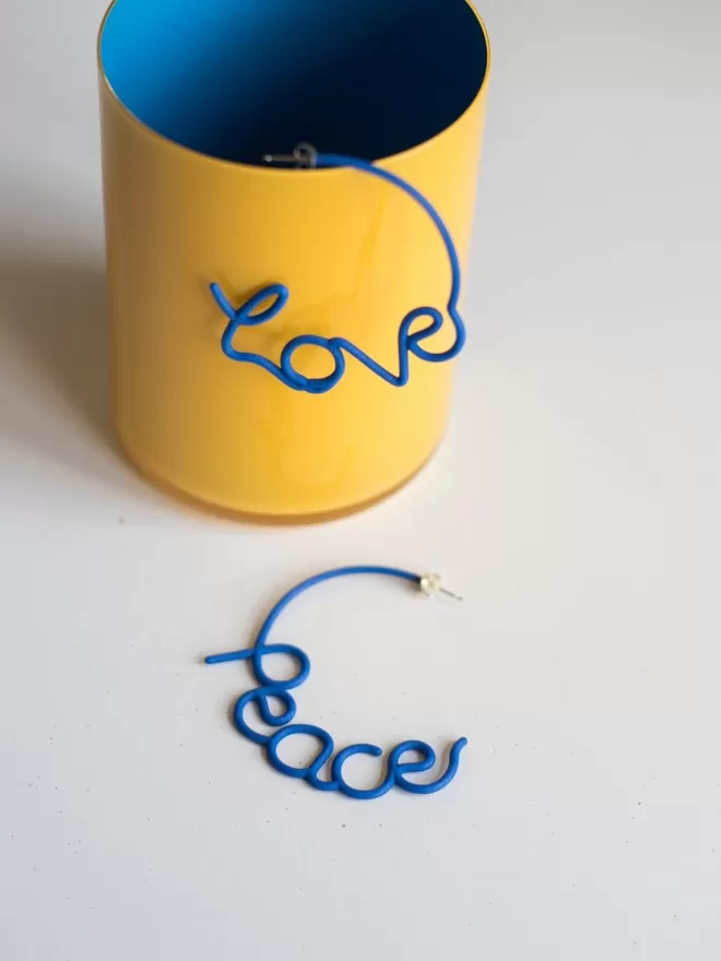 Zoe Sherwood Love and Peace Blue large earrings.