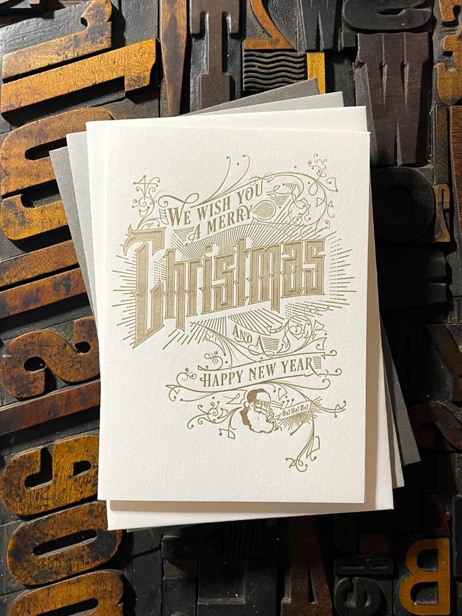 Spread festive cheer with this charming vintage Santa letterpress Christmas card! These cards are printed with my own fair hands on my 1915 Arab Crown Folio Press. Printed in metallic gold ink.