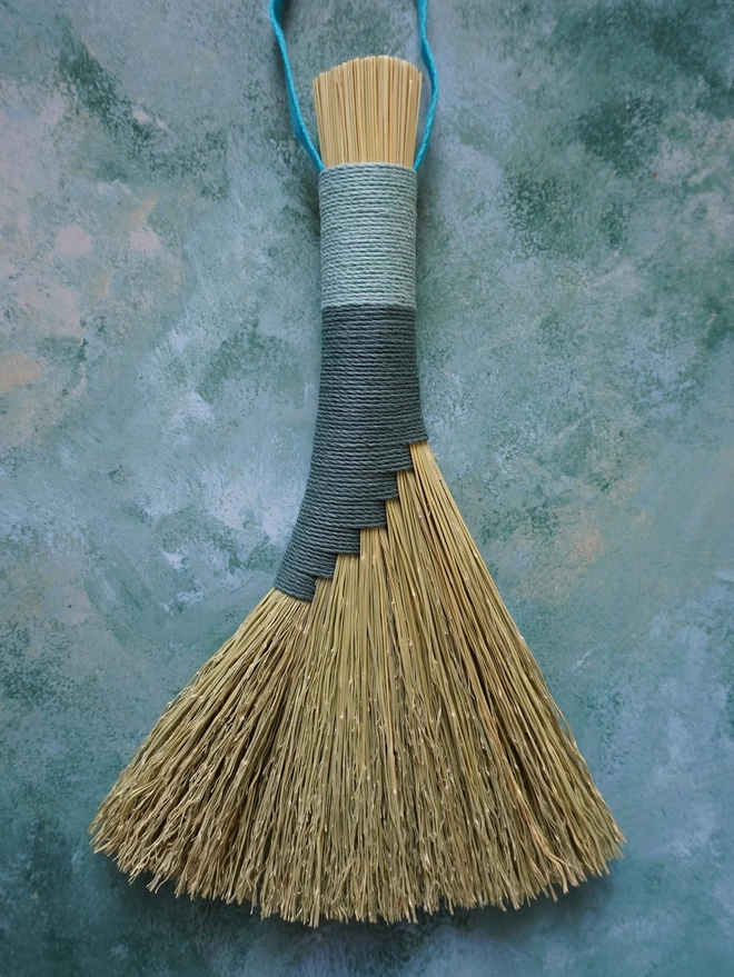 Handmade broomcorn brush with teal and light blue hemp cord binding