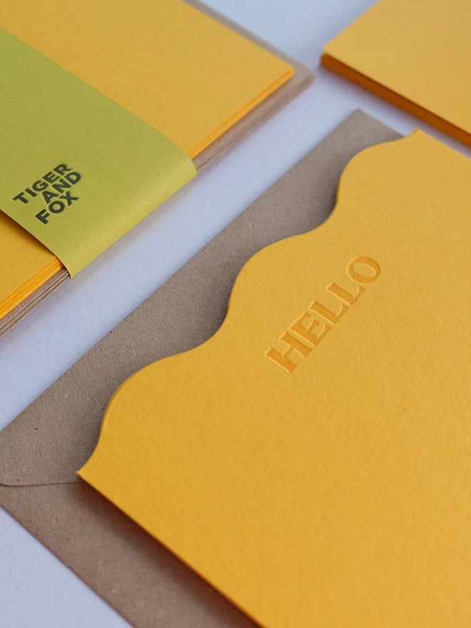 Set of 'Hello' yellow notecards with Kraft envelope.