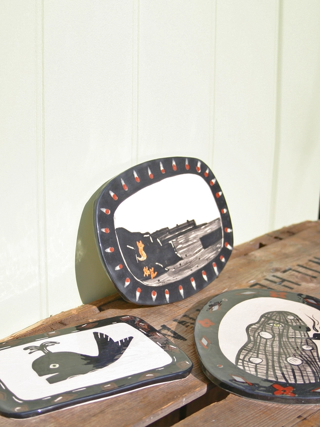 ceramic wall art decorative seaside silhouette of foxy rocks, Captain Netty and Whale  