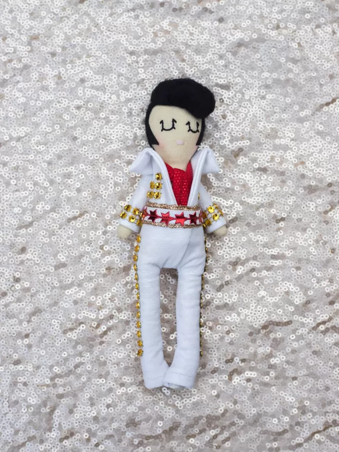 Elvis Presley seen on a sequinned fabric.