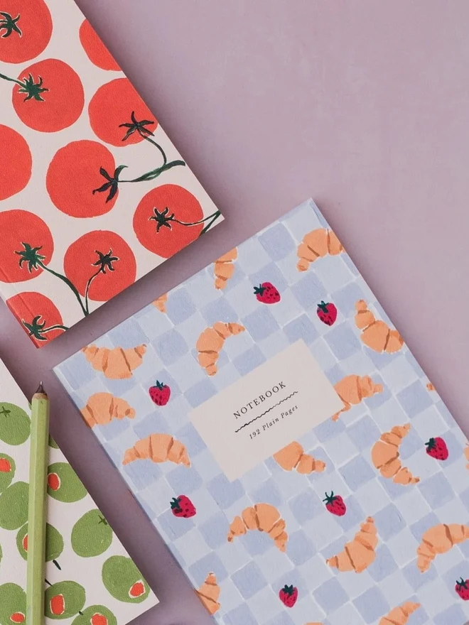 Croissant Cafe Notebook beside the Tomatoes Notebook