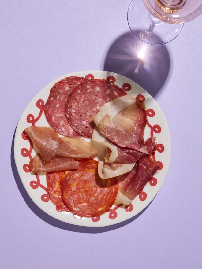 An example of a charcuterie plate, curated using the contents of the gift box. Salami, chorizo, air dried ham.