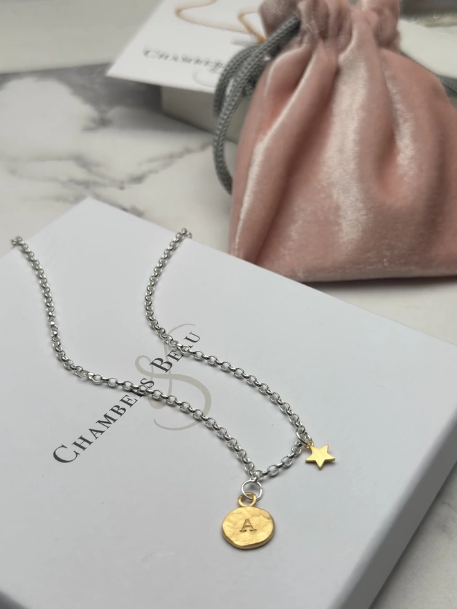 sterling silver chain with personalised gold circular charm and mini gold star