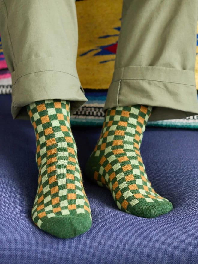 colourful patterned ankle socks, modelled in a colourful room