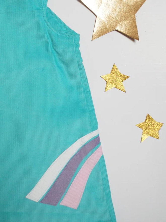 blue unicorn pinafore dress design close up