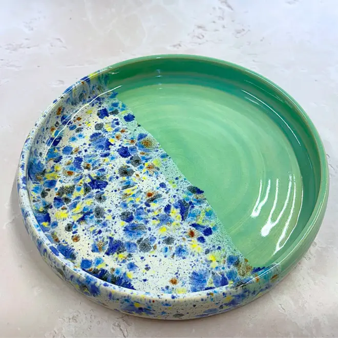 Shoreline Tray, a colourful tray placed on a stone surface. 
