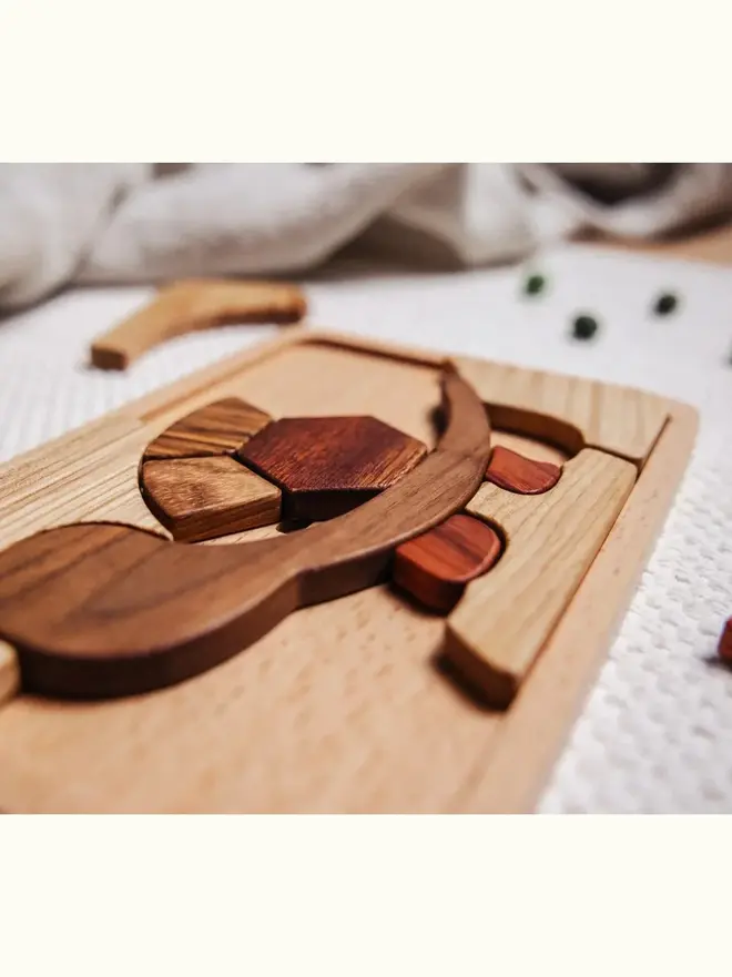 Shelly Slow Wooden Persistence Jigsaw Puzzle Heirloom Toy, against a white background. 