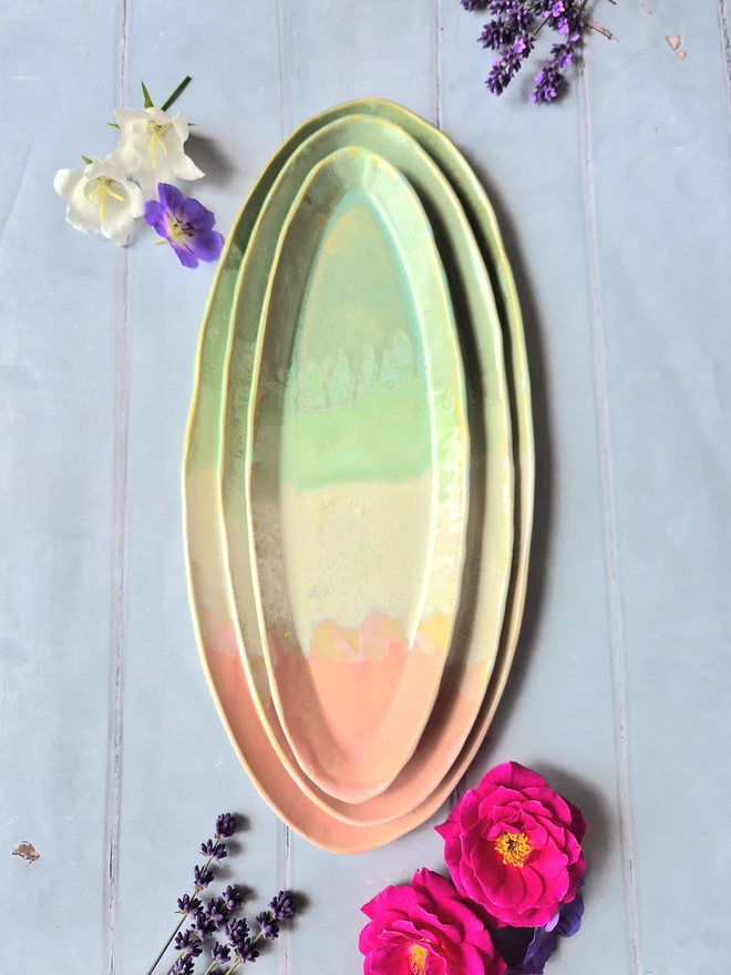 Oval serving platter, serving dish, ceramic dish, pottery dish, serveware, tableware, easter, Jenny Hopps Pottery, pink, grey background with dried flowers, ceramic gifts, gift for chef, gift for cooks, gift for her, gift for him, gift for friends, housewarming gift, pink, white and green
